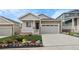 Charming single-Gathering home features stone accents, covered porch, well manicured lawn, and attached two car garage at 2149 Peralta Loop, Castle Rock, CO 80104