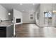 Spacious living area with a fireplace, open floor plan, and sliding glass doors to the outdoor space at 2149 Peralta Loop, Castle Rock, CO 80104