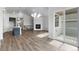 Open-concept kitchen and living area with a fireplace and sliding glass doors to a bright outdoor space at 2149 Peralta Loop, Castle Rock, CO 80104
