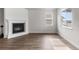 Living room featuring a fireplace, windows, and hardwood floors at 2149 Peralta Loop, Castle Rock, CO 80104