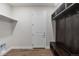 Mudroom features wood flooring, coat hooks and a bench, perfect for organization at 2149 Peralta Loop, Castle Rock, CO 80104