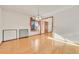 Bright dining room with hardwood floors, natural light, and a view of the front yard at 5863 S Danube St, Aurora, CO 80015