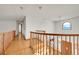 Hallway with wooden banister and plenty of natural light at 5863 S Danube St, Aurora, CO 80015