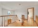 Hallway with wooden banister and plenty of natural light at 5863 S Danube St, Aurora, CO 80015