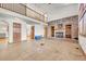 Spacious living room featuring a brick fireplace, high ceilings, and an open layout to the upstairs at 5863 S Danube St, Aurora, CO 80015