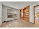 Cozy office space with built-in bookshelves, a large window, and neutral colors at 5863 S Danube St, Aurora, CO 80015