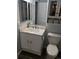 Clean bathroom with white vanity, marble countertop, and updated fixtures at 12222 Bannock Cir # D, Denver, CO 80234