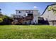 Expansive backyard featuring multiple decks and green space, perfect for outdoor enjoyment at 22739 E Prentice Pl, Aurora, CO 80015