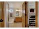 A well-maintained bathroom offers a tub-shower combo, double vanity, and access to a walk-in closet at 22739 E Prentice Pl, Aurora, CO 80015