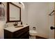 Powder room featuring a stained wood vanity and a vessel sink at 22739 E Prentice Pl, Aurora, CO 80015