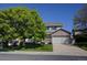 Attractive two-story home with a well-kept lawn, offering a welcoming curb appeal and a two-car garage at 22739 E Prentice Pl, Aurora, CO 80015
