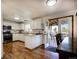 Modern kitchen with white cabinetry, stainless steel appliances, and an easy access to the deck at 22739 E Prentice Pl, Aurora, CO 80015