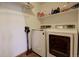 Laundry room with a front-load washer and dryer at 22739 E Prentice Pl, Aurora, CO 80015