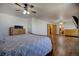 A bright and airy main bedroom features hardwood flooring, ceiling fans, and a spacious layout at 22739 E Prentice Pl, Aurora, CO 80015