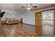 The main bedroom features hardwood floors, multiple ceiling fans, and a small landing with a railing at 22739 E Prentice Pl, Aurora, CO 80015