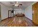 A spacious main bedroom showcases hardwood flooring, multiple ceiling fans, and an open floor plan at 22739 E Prentice Pl, Aurora, CO 80015