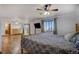 The main bedroom offers hardwood floors, a ceiling fan, and access to the ensuite bathroom and outdoor balcony at 22739 E Prentice Pl, Aurora, CO 80015