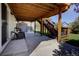 Covered patio includes furniture and stairs leading to the deck and backyard at 22739 E Prentice Pl, Aurora, CO 80015