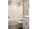 Bright bathroom featuring a shower-tub combo and vanity with modern fixtures at 21795 E 8Th Ave, Aurora, CO 80018