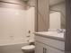 Bathroom boasts a tiled shower-tub, modern vanity and sink with elegant faucet at 21795 E 8Th Ave, Aurora, CO 80018