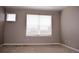 Bright bedroom with neutral walls, carpet, and two windows providing ample natural light at 21795 E 8Th Ave, Aurora, CO 80018