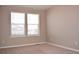 Bright bedroom with neutral walls, carpet, and two windows providing ample natural light at 21795 E 8Th Ave, Aurora, CO 80018