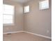 Bedroom filled with natural light from three bright windows and neutral carpet at 21795 E 8Th Ave, Aurora, CO 80018