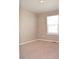 Cozy bedroom with neutral walls, light-colored carpet, and natural light at 21795 E 8Th Ave, Aurora, CO 80018
