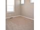 Bedroom with neutral carpet, light-colored walls, and bright windows at 21795 E 8Th Ave, Aurora, CO 80018