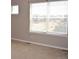 Bright bedroom with neutral walls, carpet, and two windows providing ample natural light at 21795 E 8Th Ave, Aurora, CO 80018