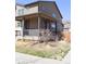 Charming home features a covered porch and neat landscaping at 21795 E 8Th Ave, Aurora, CO 80018