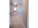 Hallway featuring neutral walls, carpet, and several access doors at 21795 E 8Th Ave, Aurora, CO 80018