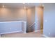 Hallway featuring neutral walls, carpet, and staircase at 21795 E 8Th Ave, Aurora, CO 80018