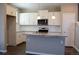 Beautiful kitchen with white cabinetry, granite countertops, stainless steel appliances, and modern fixtures at 21795 E 8Th Ave, Aurora, CO 80018