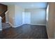 Spacious living room featuring hardwood floors, natural light, and a staircase to the upper level at 21795 E 8Th Ave, Aurora, CO 80018