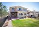 Charming home with a well-kept lawn, back patio with pergola, and inviting outdoor space at 2559 S Kendrick St, Lakewood, CO 80228