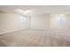 Expansive finished basement featuring plush carpeting, recessed lighting, and natural light at 2559 S Kendrick St, Lakewood, CO 80228