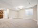 Spacious finished basement with plush carpeting, a rustic barn door and ample natural light at 2559 S Kendrick St, Lakewood, CO 80228