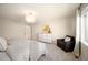 Cozy bedroom features a neutral palette, soft lighting, and a relaxing reading nook at 2559 S Kendrick St, Lakewood, CO 80228
