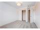 Bright bedroom featuring plush carpet, double closets, and trim painted in a light, neutral color at 2559 S Kendrick St, Lakewood, CO 80228