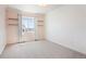 Serene bedroom with soft pink walls, natural light, plush carpet, and stylish floating shelves at 2559 S Kendrick St, Lakewood, CO 80228