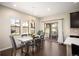 Dining room with a modern chandelier, lots of natural light and a sliding door to outside at 2559 S Kendrick St, Lakewood, CO 80228