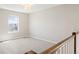 Open and airy loft space with carpet, neutral walls and lots of natural light at 2559 S Kendrick St, Lakewood, CO 80228