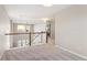 Second story lofted space with views to a living room and hallway at 2559 S Kendrick St, Lakewood, CO 80228