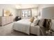 Serene bedroom featuring a plush bed, soft lighting, and stylish decor at 2559 S Kendrick St, Lakewood, CO 80228