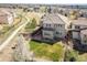 Aerial view of a beautifully landscaped home with a pergola-covered patio in a desirable neighborhood at 2559 S Kendrick St, Lakewood, CO 80228