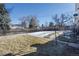 Backyard with grassy area and snow cover at 6740 S Clarkson St, Centennial, CO 80122