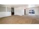 Open living and dining area with patio access at 6740 S Clarkson St, Centennial, CO 80122