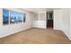 Bright living room with large window and carpeted floor at 6740 S Clarkson St, Centennial, CO 80122