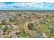 Wide angle aerial shot of a residential neighborhood with mature trees at 10342 Monterey Cir, Northglenn, CO 80260